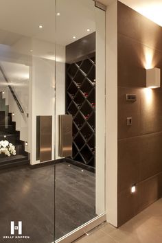 a wine cellar in the corner of a room