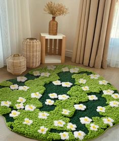 a green rug with white flowers on it