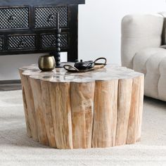 a wooden table sitting in the middle of a living room