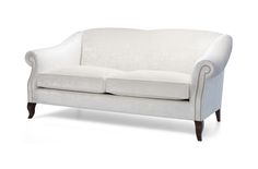 a white couch sitting on top of a wooden frame