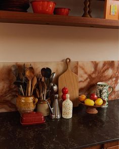 kitchen counter with utensils and bowls on it