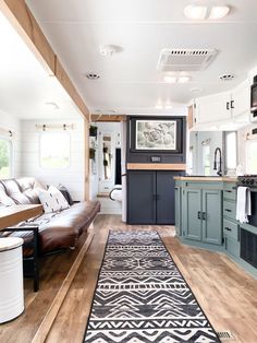 a living room and kitchen area in a mobile home