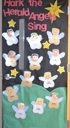 a door decorated with angels and stars for the children's angel song, which is written