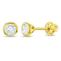 two pairs of yellow gold plated earrings with cubics on each side and a single diamond