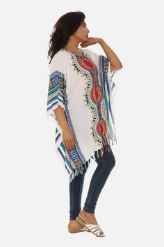 Introducing the Stunning White Caftan made from soft and breathable cotton base, adorned with a striking multi-colored tribal print and finished off with playful tassels. This bohemian-inspired caftan is the perfect addition to your summer wardrobe, offering comfort and style all in one. Bohemian Multicolor Printed Cover-up, Bohemian Multicolor Tunic Cover-up, Multicolor Bohemian Cotton Cover-up, Bohemian Multicolor Cotton Cover-up, Multicolor Tassel Beach Cover-up, Multicolor Short Sleeve Cover-up For Festival, Hippie Multicolor Festival Cover-up, Multicolor Short Sleeve Festival Cover-up, Bohemian Multicolor Tassel Cover-up