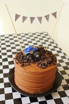 a birthday cake with a monster truck on top