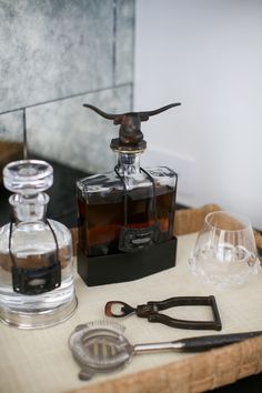 Longhorn Decanter with Clear Glass and Iron Base Styled in Home White Linens, Cork Screw, Whiskey Decanter, Wood Tones, Bar Room, Glass Decanter, California Homes, Decanters, Orange County