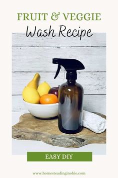 a bottle of soap next to a bowl of fruit and veggie wash recipe