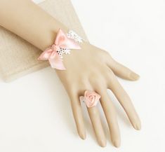 Buy Sweet Pink Bow Rose Girls Lolita Bracelet And Ring Set on Lolitain.com. Choose your perfect classic lolita dress, gothic lolita dress, and more. Regular discounts up to 50% off. Baroque Jewelry, Bridesmaid Rings, Ring Bracelet Chain, Lace Bracelet, Bracelet Accessories, Bow Bracelet, Lace Bands, Ring Chain, White Bracelets