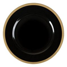 an empty black and gold plate on a white background