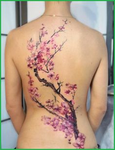 a woman's back with pink flowers on it