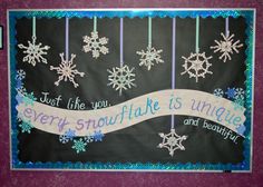 a bulletin board with snowflakes hanging from it's sides and a ribbon that says, just the you every snowflake is unique and beautiful