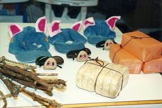 various items are displayed on a table with sticks and other things to make it look like they're wearing bunny ears