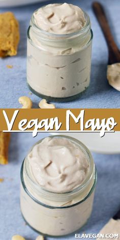 two jars filled with whipped cream on top of a blue table