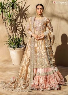 Farshi Gharara for Walima with Long Shirt Online is emblazoned with embroidery, dabka and sequins. Long Shirt with traditional heavy ghara is adding modish look to overall bridal dress. This designer gharara dress is best choice for walima events so order this dress online and make your wedding event special. Shirt: Shirt for wedding dress in golden color is embellished with glittery sequins, dabka, red stones, tilla work. Shirt front is fully embellished with dabka, glittery crystals, sequins e Bridal Gharara, Gharara Designs, Walima Dress, Nikkah Dress, Bridal Dresses Pakistan, Bridal Dress Fashion, Pakistani Bridal Dresses, Pakistani Wedding Dresses, Pakistani Bridal Wear