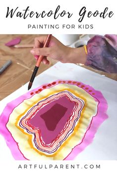 a child is painting with watercolors on paper and the words watercolor goblet painted for kids