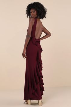 the back of a woman wearing a burgundy gown