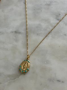 This stunning Miraculous Medal necklace is sure to become a cherished heirloom for years to come! The front of the medal features the image of the traditional Miraculous Mary, wreathed with tiny enamel turquoise accents. On the back, the traditional Miraculous Medal backing is stamped. This necklace was lovingly created using a vintage mold found in a New England jewelry shop. We just adore its timeless and truly classic look! 3/4" medallion, 18"-20" fine cable chain, 14k gold over brass. Design Miraculous Medal Necklace, Instagram Family, Turquoise Accents, Confirmation Gifts, Miraculous Medal, Sacred Art, Sacred Heart, Cable Chain, True Beauty