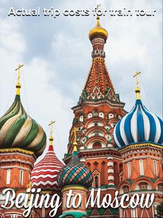 the domes on this building are painted in different colors and designs, with gold spires