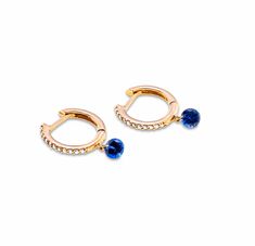 Our new drilled blue sapphire earrings, set in 18K gold pave diamond hoops. The diamonds and gemstones are drilled with a laser so they hang invisibly without a setting.To be worn casual or dress it up as primary piercing, second, or multiple position earrings. Our latest timeless trend that our customers love for themselves or as special gifts for a friend or loved one. Also available in Emerald, pink sapphire, blue sapphire, and ruby 18K gold (yellow, rose, or white) 1.09 cts round diamonds .2 Elegant Blue Drop Huggie Earrings, Elegant Blue Single Huggie Earring, Gifts For A Friend, Blue Sapphire Earrings, Bezel Set Earrings, Signature Bracelet, Diamond Stacks, Bridal Diamond Jewellery, Anchor Necklace