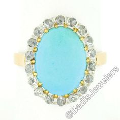 "Here we have a very lovely antique turquoise and diamond ring that was crafted in solid 18k gold with a platinum top during the Victorian era. It features a fine, Persian, oval cabochon cut turquoise stone neatly set at its center. The natural stone has a super attractive robin's egg blue color, and is wonderfully complemented by a halo of 18 old rose cut diamonds, adding a glamorous touch with their brilliant sparkles. This ring remains in all original and excellent physical condition with pat Antique Oval Turquoise Wedding Ring, Antique Oval Turquoise Ring For Wedding, Antique Oval Turquoise Ring Hallmarked, Antique Oval Turquoise Ring, Antique Turquoise Cabochon Ring For Wedding, Antique Style Turquoise Wedding Ring With Cabochon, Formal Oval Turquoise Ring With Diamond, Oval Diamond Turquoise Ring For Formal Occasions, Oval Turquoise Ring In Yellow Gold With Diamond