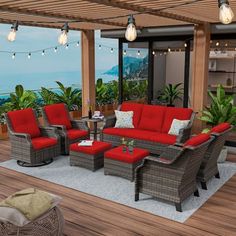 an outdoor living room with red couches and chairs