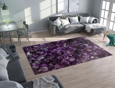 a living room filled with furniture and a purple rug