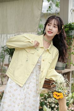 Fun light yellow denim jacket with embroidered daisies flying around. Regular low waist/hip length with side pockets and faux chest pocket flaps. S: 21.5" across shoulders, 45" chest, 20" lengthM: 22" across shoulders, 46.5" chest, 20.5" lengthL: 22.5" across shoulders, 48" chest, 21" length Yellow Cotton Denim Jacket For Fall, Yellow Cotton Denim Jacket With Pockets, Yellow Denim Jacket With Pockets For Fall, Summer Casual Denim Jacket With Floral Embroidery, Yellow Cotton Summer Outerwear, Yellow Spring Outerwear With Pockets, Casual Summer Denim Jacket With Floral Embroidery, Yellow Long Sleeve Denim Jacket, Casual Floral Embroidered Denim Jacket For Summer