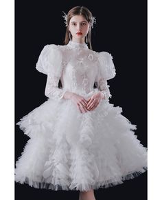 Buy vogue puffy ruffled tulle knee length wedding dress with bubble sleeves at wholesale price online. Free shipping and pro custom service since 2009. Champagne Ball Gown, Vintage Weddingdress, Tiered Wedding Dress, Gaun Abad Pertengahan, Delicate Gown, Knee Length Wedding Dress, White Ball Gowns, Blue Ball Gowns, Ruffle Flower