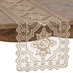 two pieces of lace on top of a wooden table