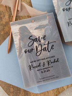 save the date cards on top of blue envelopes