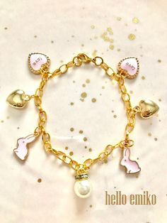 Pink Enamel Bunny Charm Bracelet Gold Plated Chain Pink Enamel Love Hearts Large Pearl Rhinestone Drop Bead Gold Heart Charms Measures 8 inches with Lobster Claw Clasp A fun and whimsical gift for any teen, woman or animal lover. Ships within 3 days. Will ship first class mail.  See our shop Hello Emiko for more beautiful handmade jewelry and gifts. Whimsical Gifts, Pink Bunny, Gold Charm Bracelet, Pink Enamel, Love Hearts, Drop Beads, Religious Jewelry, Pink Love, Gold Heart