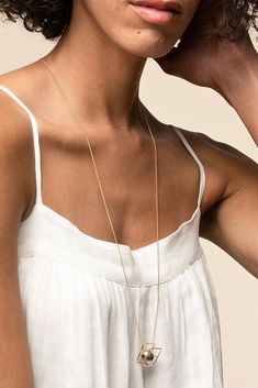 Our Ball necklace features a sleek silver ball pendant with a delicate chain. Add a little drama and depth to your daily fashion level with our ball necklace. It comes in brass material with a polyurethane coating and will prove the sturdiest of jewelry pieces even if you wear it daily.- Brass with Matte Polyurethane Coating- Approx. width is 1mm- Chain length measures 30"- Available in Gold, Silver, Bronze, and Dark Grey Minimalist Metal Necklaces For Layering, Minimalist Satellite Chain Necklace With Round Pendant, Minimalist Long Charm Necklaces For Layering, Minimalist Long Charm Necklace, Minimalist Brass Charm Necklace For Everyday, Layering Ball Chain Necklace, Minimalist Jewelry With Ball Chain And Round Pendant, Everyday Minimalist Brass Charm Necklace, Minimalist Brass Chain Necklace