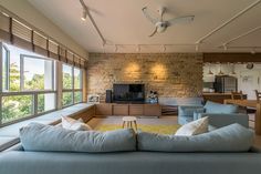 a living room filled with furniture and a flat screen tv