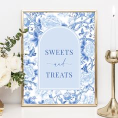 a blue and white floral print with the words sweets and treats on it next to a candle