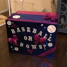 a box that has some balls on it and bows around the edges with words baseball or bows?