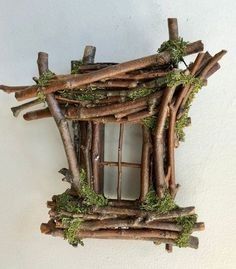 a house made out of sticks and moss