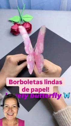 a woman is holding a paper butterfly in front of her face and the caption reads, borboletass lindaas de papel