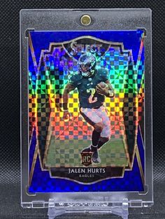 a football card that is on display in a clear case with the name jalen hurts