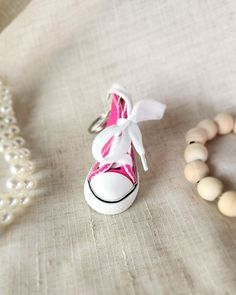 Add some sneaker style to your keychain with our Converse Shoe Keychain! This quirky accessory is perfect for any sneakerhead and makes a fun statement piece. Never lose your keys again with this playful and functional keychain. Sneaker Key Chain, Casual White Keychains With Key Leash, Casual White Keychain With Key Leash, Casual Pink Sneakers For Gift, Trendy White Keychain With Key Leash, Shoe Keychain, Sneaker Style, Sneaker Head, Sneakers Fashion