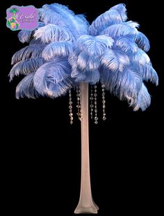 a tall blue palm tree with lots of feathers on it's trunk and beads hanging down from the base