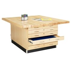 a wooden table with drawers underneath it and a pen holder on the bottom shelf next to it