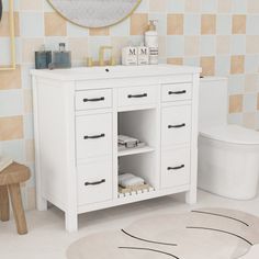 a bathroom with a toilet, sink and mirror on the wall next to a rug