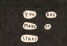 the words you are made of stars written in white ink on a black paper background