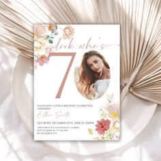 this is an image of a floral 70th birthday party card with the number seven on it