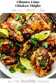 chicken thighs with cilantro and lime on a white plate