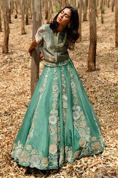 Teal panel lehenga with floral hand embroider. Paired with shimmer boxy top.
Component: 2
Pattern: Hand Embroidered
Type Of Work: Zari, Sadi, Mirrors and Sequins
Neckline: Round
Sleeve Type: Half
Fabric: Lehenga: Organza, Top: Tissue
Color: Green
Other Details: 
Front concealed button top
Occasion: Mehendi and Haldi - Aza Fashions Panel Lehenga, Zari Lehenga, Lehenga Top, Organza Top, Green Lehenga, Embroidered Lehenga, Boxy Top, Indian Designer Outfits, Floral Pants