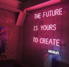 a neon sign that reads, the future is yours to create absolut '