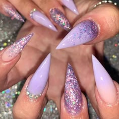 January Stiletto Nails, Lavender Nails Glitter, Lilac Nail Designs Lavender, Purple Pointy Nails, Lavender Stiletto Nails, Lilac Prom Nails, Purple Nails Stiletto, Purple Stiletto Nails Design, Purple Glitter Nail Designs