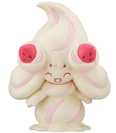 a white and pink figurine with two eyes on it's head, holding its arms up